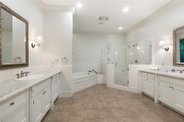 bathroom with independent shower and bath, tile patterned floors, crown molding, and vanity