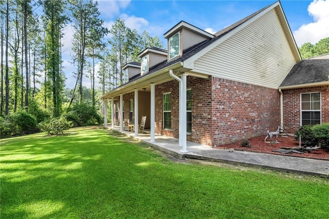 rear view of house with a lawn