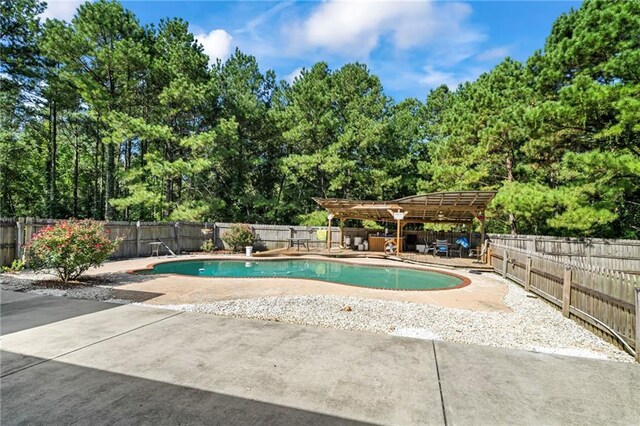 view of swimming pool with a pergola and a patio