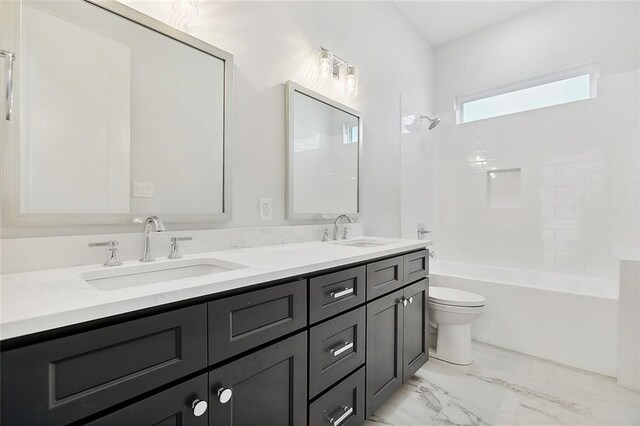 full bathroom featuring dual vanity, bathtub / shower combination, toilet, and tile patterned flooring