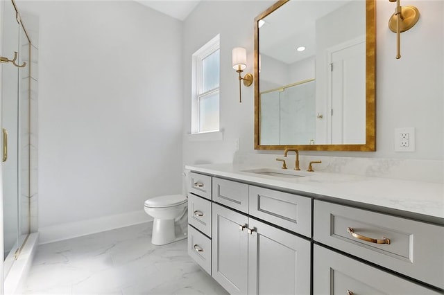 bathroom featuring vanity, toilet, and a shower with door