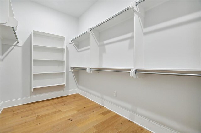 walk in closet featuring light hardwood / wood-style flooring