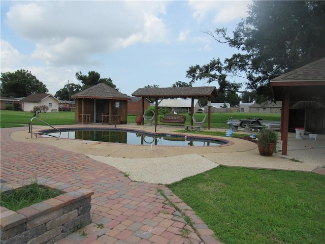 view of swimming pool with a patio, a gazebo, and a lawn