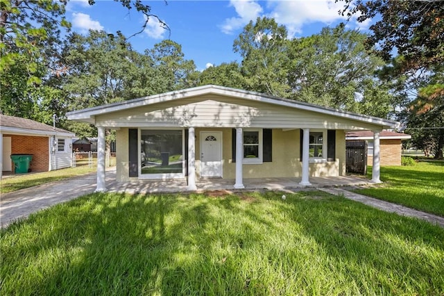 view of front of house with a front yard and covered porch