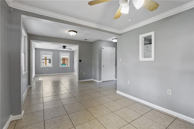 tiled spare room with crown molding and ceiling fan