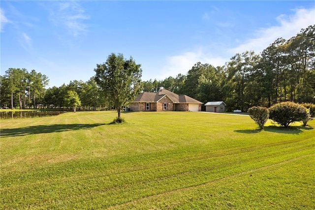 view of yard with a rural view