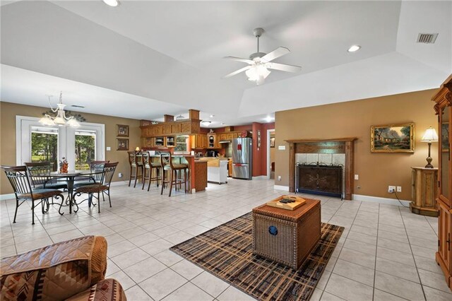 17 P M Hall Rd, Poplarville, MS 39470 - living room with light tile patterned flooring, ceiling fan with notable chandelier, and a tray ceiling