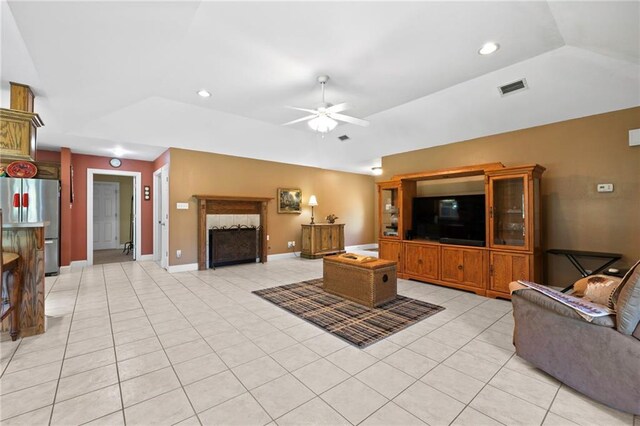 17 P M Hall Rd, Poplarville, MS 39470 - tiled living room featuring a fireplace, ceiling fan, and lofted ceiling