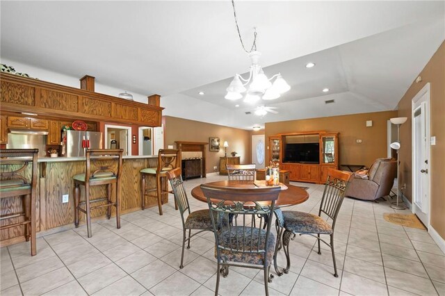 17 P M Hall Rd, Poplarville, MS 39470 - dining space with an inviting chandelier, light tile patterned flooring, and vaulted ceiling