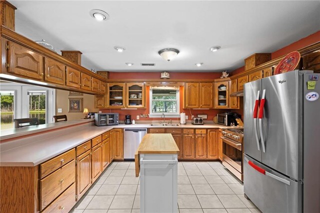 17 P M Hall Rd, Poplarville, MS 39470 - kitchen with light tile patterned flooring, sink, stainless steel appliances, and wooden counters