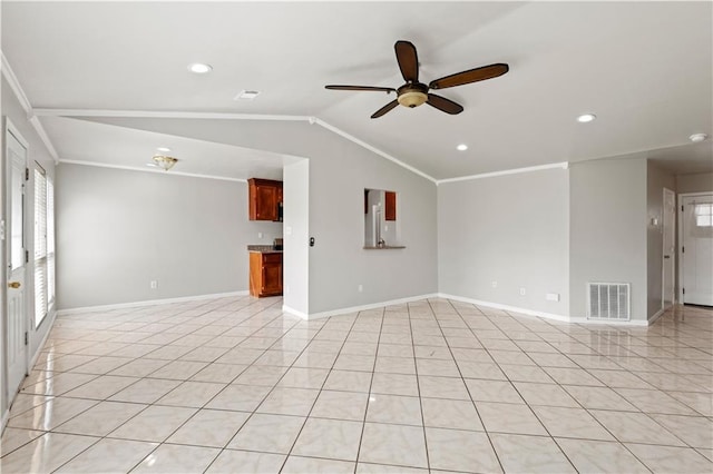 unfurnished room with a healthy amount of sunlight, crown molding, lofted ceiling, light tile patterned flooring, and ceiling fan