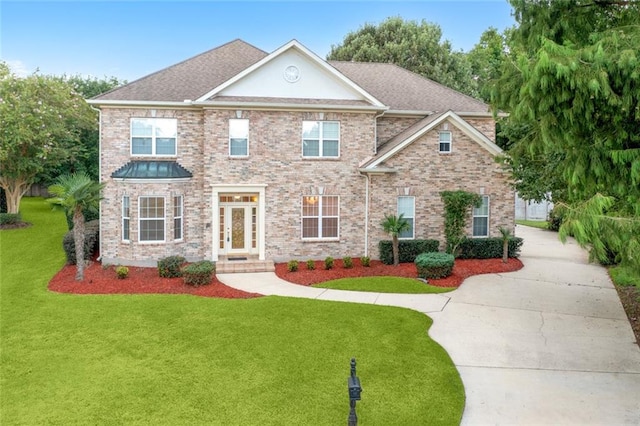 view of front of property featuring french doors and a front yard