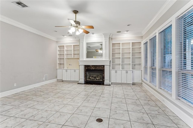 unfurnished living room featuring ornamental molding, light tile patterned flooring, a fireplace, and ceiling fan