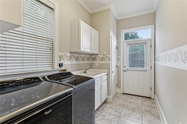 washroom with light tile patterned flooring, crown molding, sink, washer and dryer, and cabinets