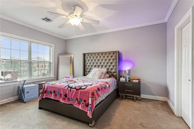 carpeted bedroom featuring ceiling fan and ornamental molding