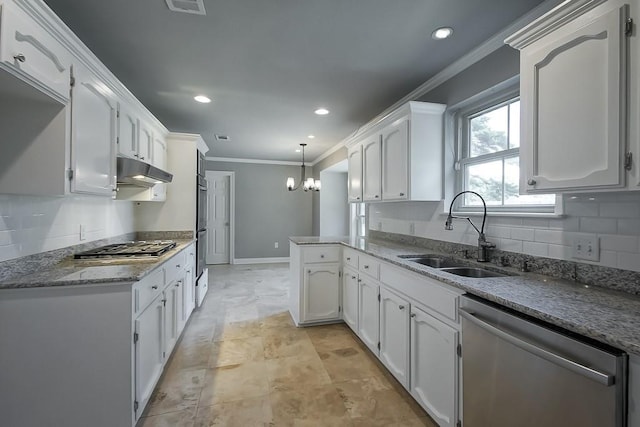 kitchen featuring white cabinetry, sink, a chandelier, and appliances with stainless steel finishes