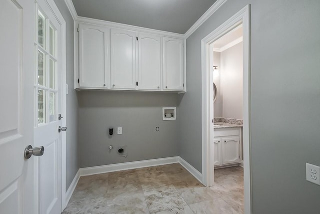 laundry area featuring gas dryer hookup, cabinets, crown molding, hookup for a washing machine, and hookup for an electric dryer