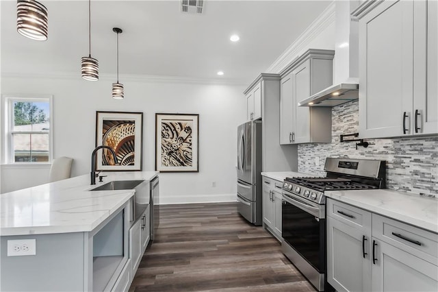 kitchen featuring crown molding, tasteful backsplash, dark hardwood / wood-style floors, wall chimney exhaust hood, and appliances with stainless steel finishes