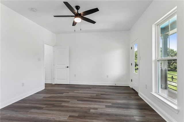 empty room featuring dark hardwood / wood-style floors and ceiling fan