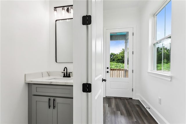 entryway featuring sink and dark hardwood / wood-style flooring