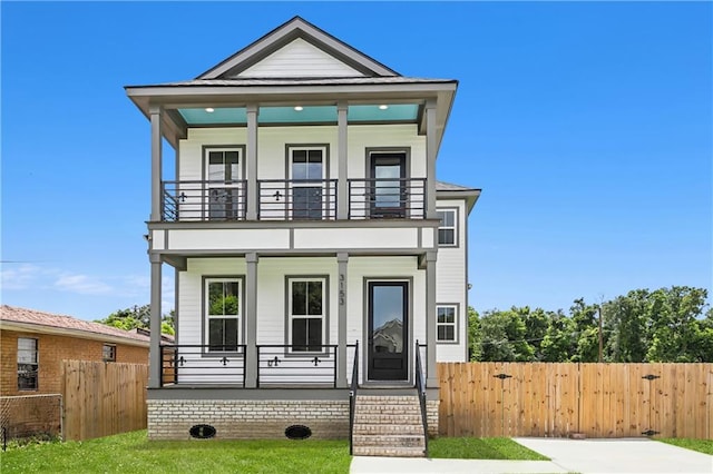 view of front of house with a balcony and covered porch