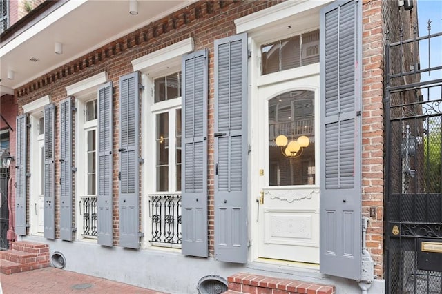 810 Bourbon St, New Orleans, LA 70116 - property entrance featuring brick siding