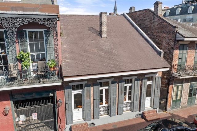 810 Bourbon St, New Orleans, LA 70116 - back of house featuring brick siding