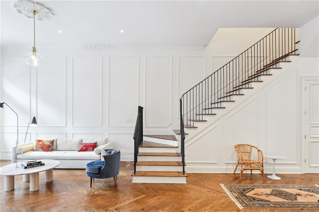 810 Bourbon St, New Orleans, LA 70116 - living room with a decorative wall and stairway