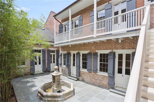 810 Bourbon St, New Orleans, LA 70116 - view of patio with a balcony