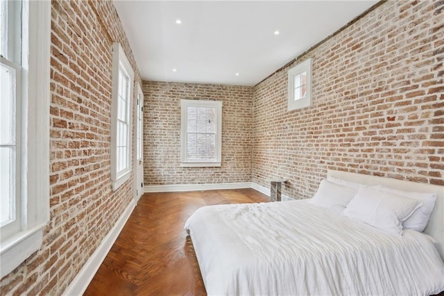 810 Bourbon St, New Orleans, LA 70116 - bedroom with brick wall and recessed lighting