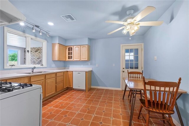 kitchen with white appliances, tile patterned flooring, light brown cabinetry, sink, and ceiling fan