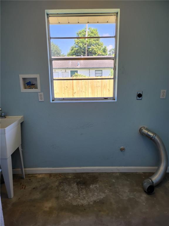 clothes washing area with electric dryer hookup and hookup for a washing machine