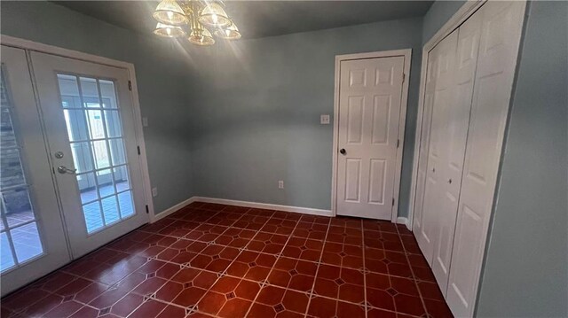 empty room with a chandelier and a healthy amount of sunlight