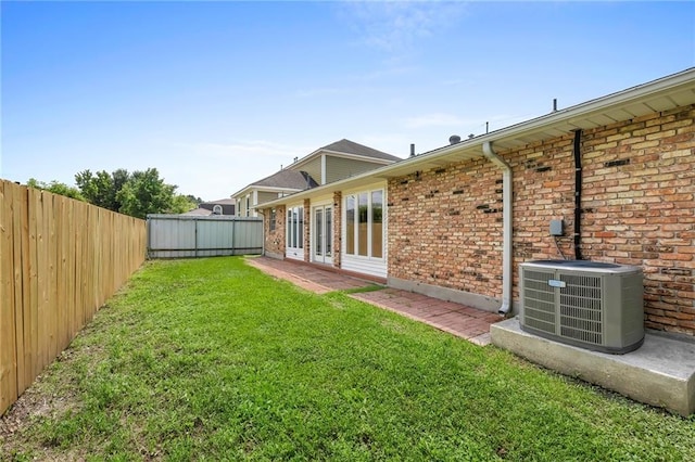 view of yard with central AC