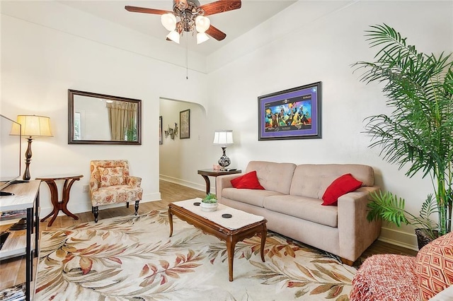 living room featuring hardwood / wood-style flooring and ceiling fan