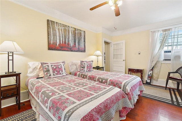 bedroom with dark hardwood / wood-style flooring, cooling unit, crown molding, and ceiling fan