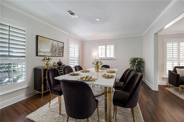 dining space featuring dark hardwood / wood-style flooring and crown molding