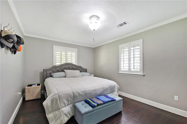 bedroom featuring multiple windows, crown molding, dark hardwood / wood-style flooring, and a textured ceiling