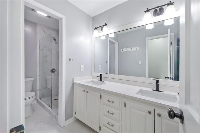 bathroom with vanity, toilet, and walk in shower