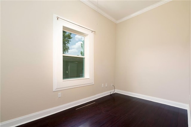 empty room with hardwood / wood-style flooring and ornamental molding