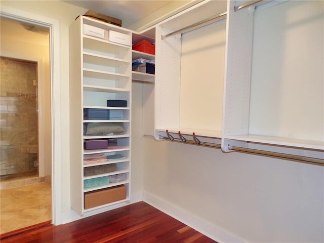 spacious closet featuring hardwood / wood-style flooring