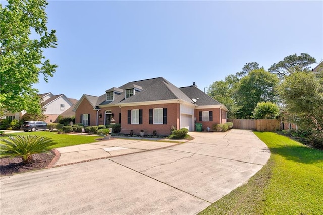 view of front of property with a front lawn and a garage