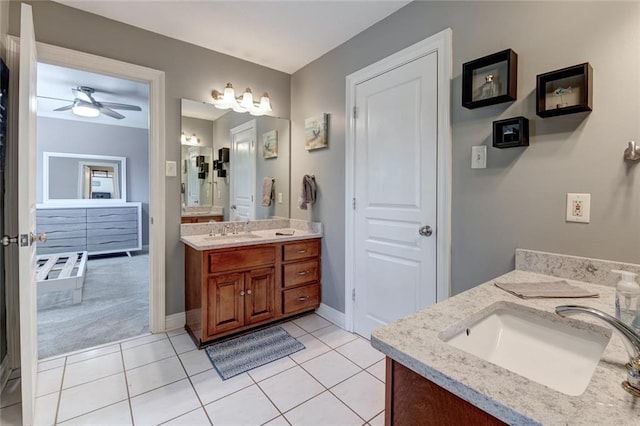 bathroom with vanity, ceiling fan, and tile patterned flooring