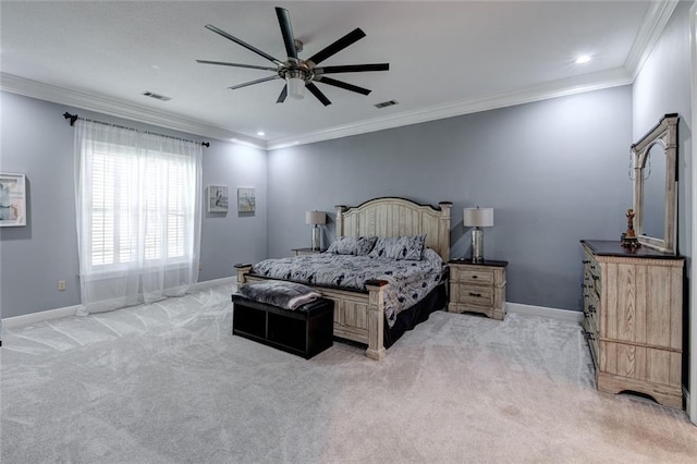 bedroom featuring ornamental molding, light carpet, and ceiling fan