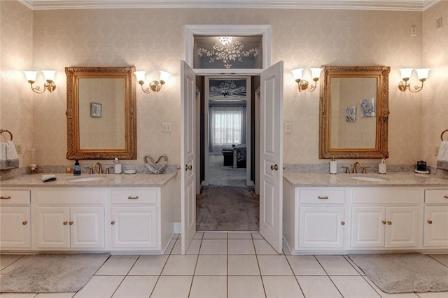 bathroom with vanity, crown molding, and tile patterned floors