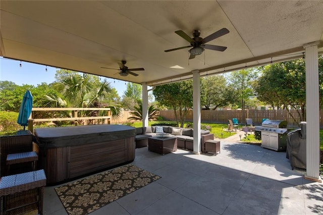 view of patio featuring a hot tub, an outdoor living space, grilling area, and ceiling fan