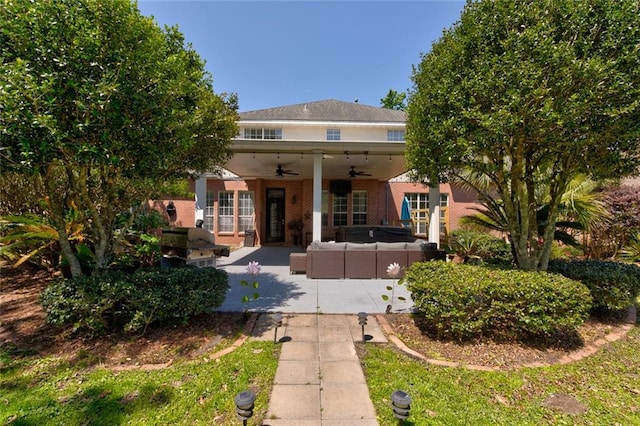 view of front of home with a patio area, french doors, outdoor lounge area, and ceiling fan