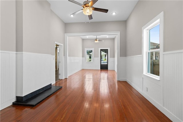 entrance foyer with hardwood / wood-style flooring, a wealth of natural light, and ceiling fan