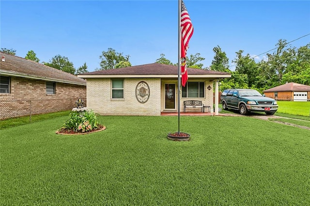 ranch-style house with a garage and a front yard