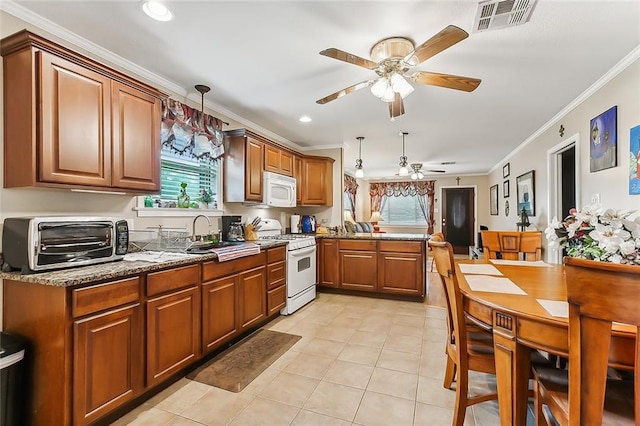 kitchen featuring light tile patterned flooring, light stone counters, ceiling fan, and white appliances